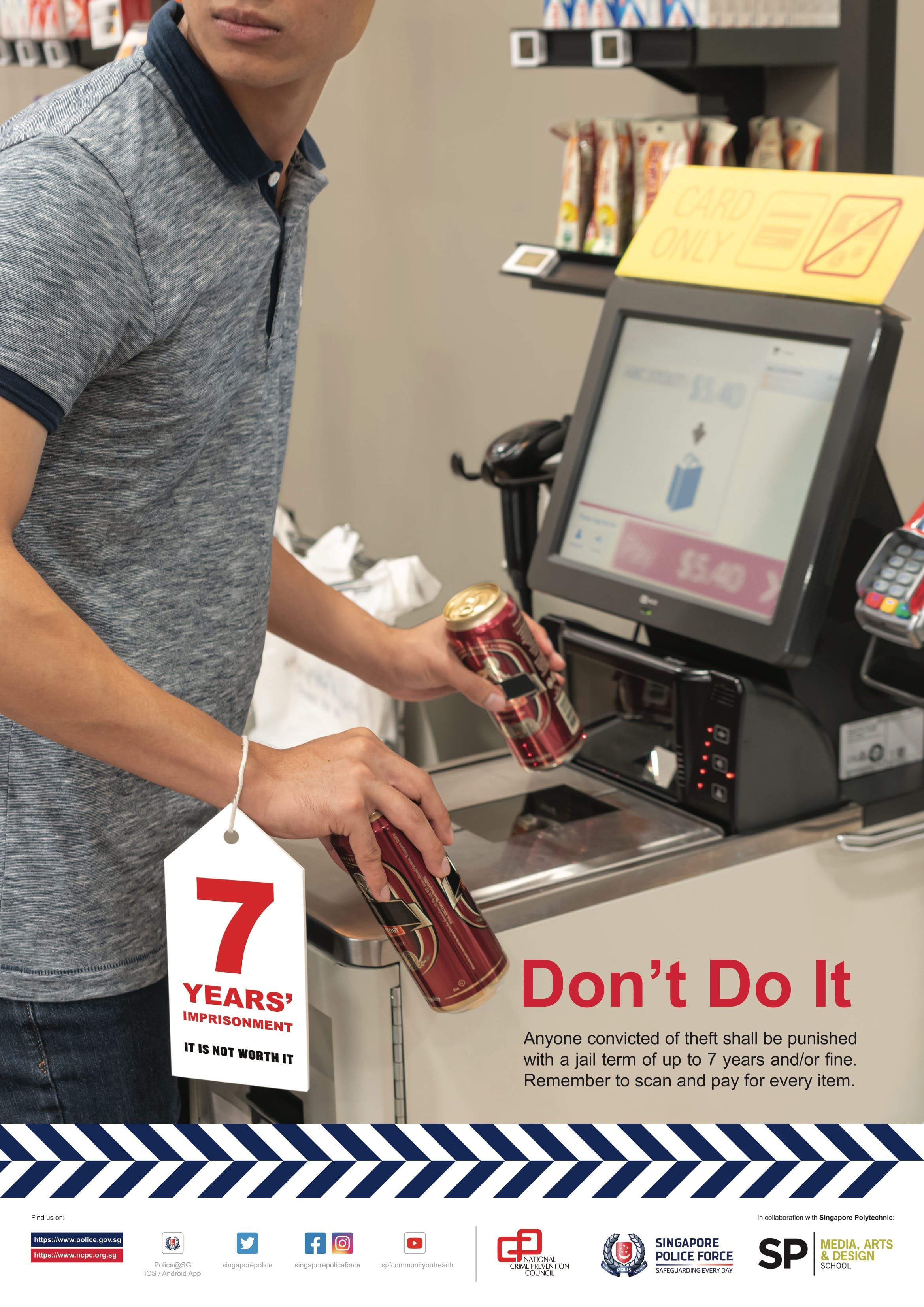 A close-up framing shows a person at a self-checkout kiosk scanning or handling two canned drinks while a hanging tag prominently displays red text reading "7 YEARS' IMPRISONMENT IT IS NOT WORTH IT".
